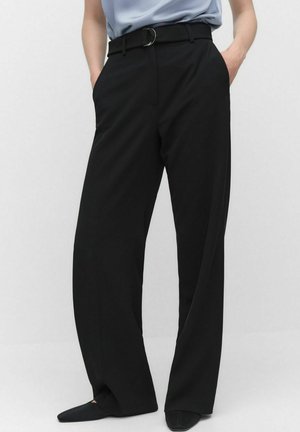 Black wide-leg trousers with a high waist, featuring a belt with a circular buckle, smooth texture, and side pockets.