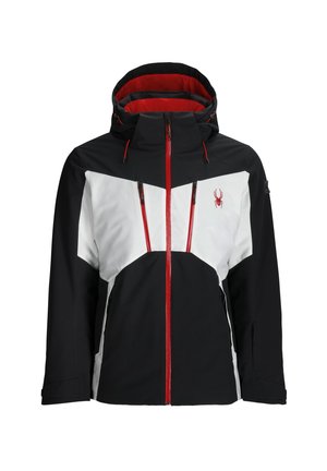 Chaqueta de esquí en negro, blanco y rojo, con capucha, paneles de color contrastante, bolsillos con cremallera y un logo de araña en el pecho.