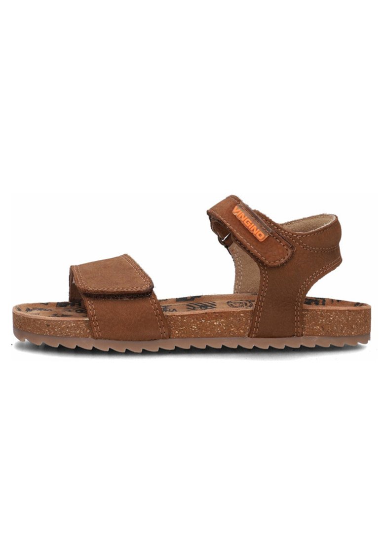 Brown leather sandals with adjustable velcro straps, textured cork sole, and a logo accent. Open design for breathability and comfort.