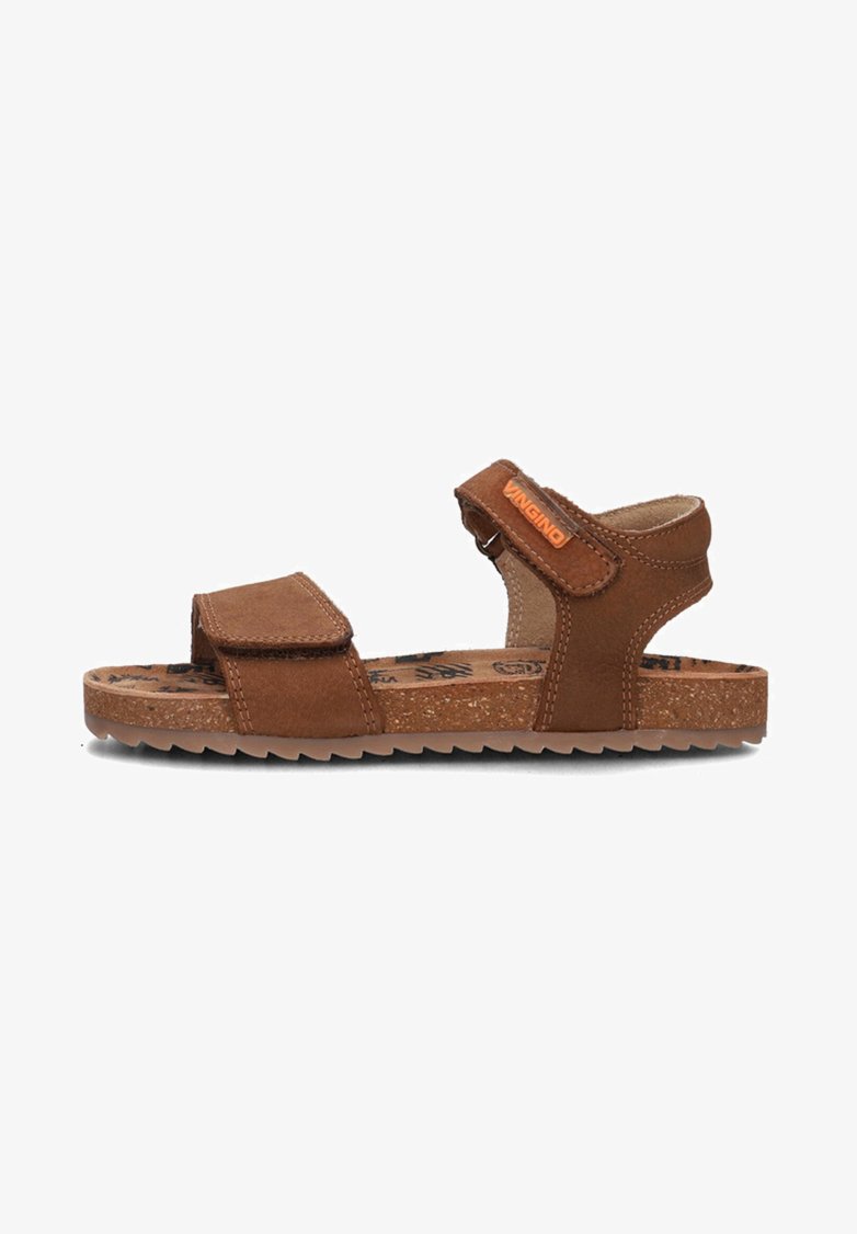 Brown leather sandals with adjustable velcro straps, textured cork sole, and a logo accent. Open design for breathability and comfort.