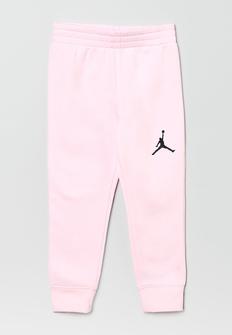 Pantalon de jogging en coton rose avec une taille élastique, des poignets ajustés et un logo Jumpman noir sur la cuisse gauche. Texture lisse.