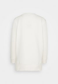Vit sweatshirt med avslappnad passform, med rund halsringning och långa ärmar. Mjuk, texturerad tyg med ribbade ärmslut och nederkant.