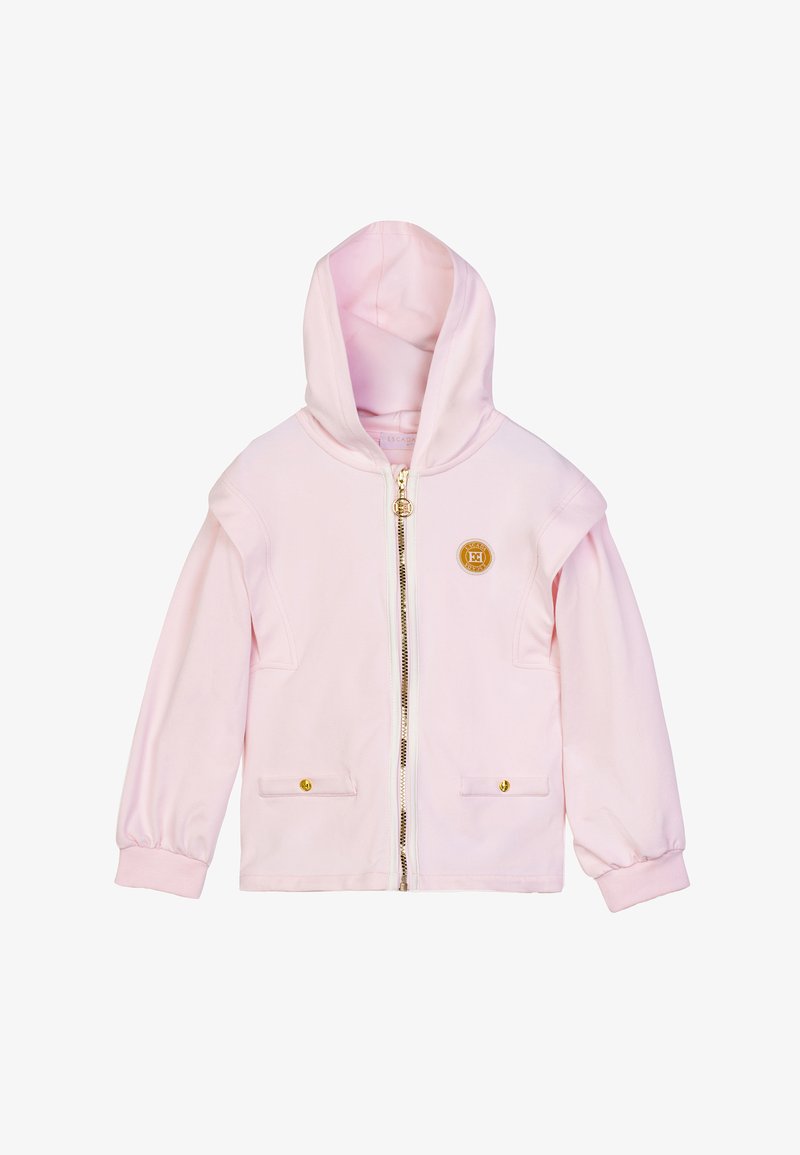 Felpa con zip rosa chiaro realizzata in tessuto morbido. Presenta una cerniera dorata e un logo, oltre a due tasche frontali con bottoni dorati.
