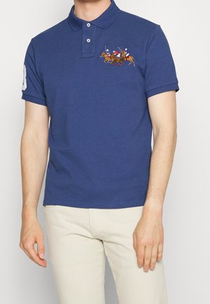 Marineblauwe polo shirt van katoen, met korte mouwen, een klassieke kraag en een kleurrijke geborduurde polo-scène op de borst.