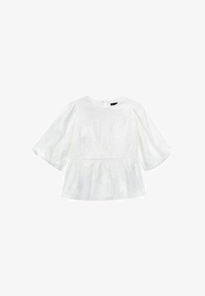 Hvid bluse med pufærmer og peplum-kant. Har teksturerede blomster mønstre og en rund halsudskæring med en nøglehul detalje i ryggen.