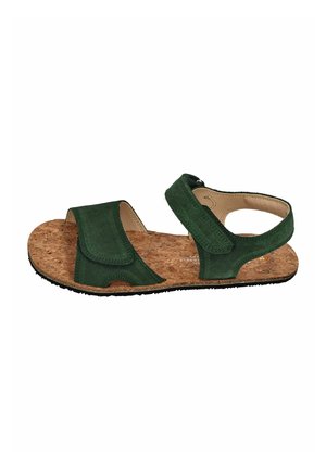 Green suede open-toe sandal with cork footbed, adjustable Velcro straps over toes and around ankle, and black rubber sole.