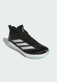 Black athletic shoe with a breathable mesh upper, white striped design, textured accents, and a translucent rubber sole. Lightweight construction.