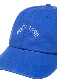 Blue cap made of cotton with a curved brim. Features "ROXY 1990" embroidered in white on the front. Finished with eyelets for ventilation.