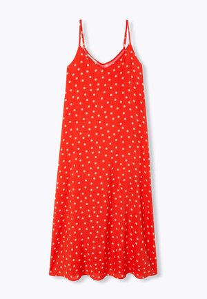 Robe midi rouge sans manches avec fines bretelles et pois blancs, dotée d'un décolleté en V et d'une silhouette fluide.
