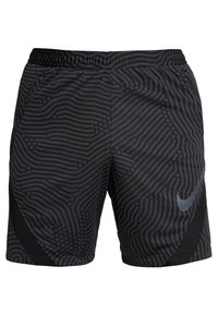 Pantalones cortos deportivos negros con patrones abstractos gris oscuro, cintura elástica, bolsillos laterales y un discreto logo de Nike en la pierna derecha.