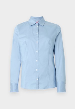 Light blue long-sleeve button-up shirt with a pointed collar, smooth cotton texture, and white buttons down the front and on the cuffs.