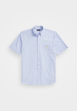 Short-sleeve, button-down shirt in light blue with white stripes; features a chest pocket and embroidered logo detail. Cotton material.