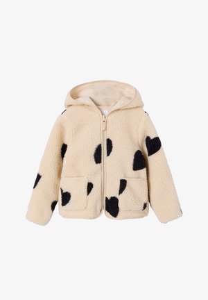 Cream-colored fleece jacket with black heart-shaped patches, zipper front, hood, and two front pockets.