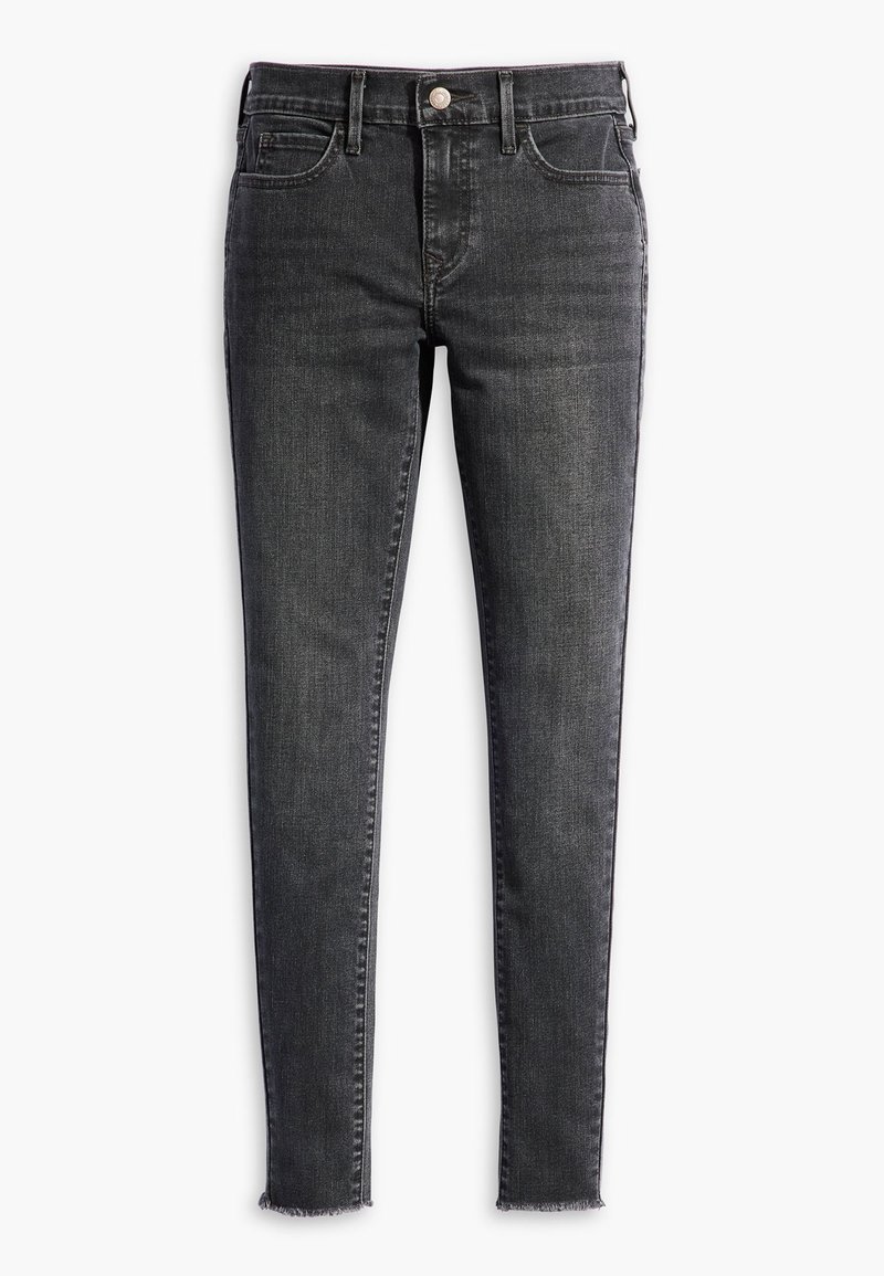 Jean en denim noir slim fit avec une texture délavée, cinq poches et un ourlet effiloché à la cheville. Fermeture par un bouton en métal unique à la taille.