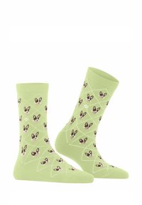 Jasnozielone skarpetki bawełniane z diamentowym wzorem, na którym znajdują się małe psie twarze w kolorze brązowym i kremowym, oferujące teksturowany wizualny kontrast.