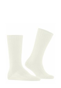Weiße Socken aus strukturiertem Strickmaterial, mit einem gerippten Bündchen und einem Wabenmuster am Schaft. Klassisches Design in Knöchelhöhe.