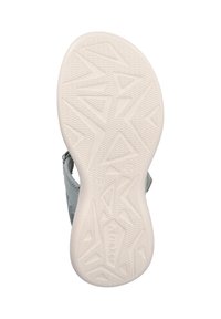 Light gray sandal with a textured rubber sole featuring angular patterns. Adjustable strap and reinforced heel for stability.