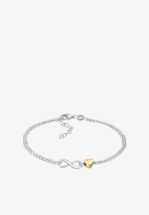 Sølv kædearmbånd med charm i guld formet som et hjerte og et uendelighedssymbol. Delikat design med en krabbe-lås og justerbar længde.