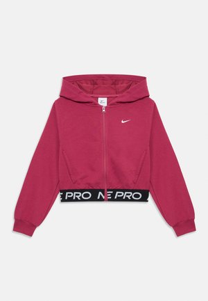 Felpa con zip di un vivace colore rosa, realizzata in tessuto morbido, con una vita ribassata nera che presenta il testo "PRO" e un logo Nike bianco sul petto.
