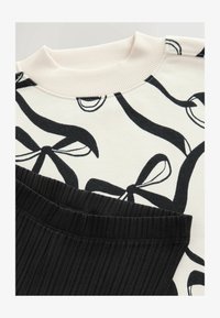 Unselected, cream bow black