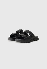 Black slide sandals with two wide straps, a smooth synthetic material, open toe design, and textured sole for added grip.