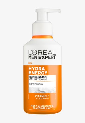 L'Oréal Men Expert Hydra Energy Reinigungsgel in einer weißen Flasche mit orangefarbener Pumpe, mit fettem schwarzem Text und glatter Textur.