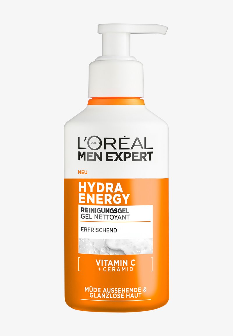 L'Oréal Men Expert Hydra Energy reinigingsgel in een witte fles met een oranje pomp, voorzien van gedurfde zwarte tekst en een gladde textuur.