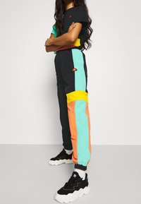 Ellesse Pantalones deportivos - black