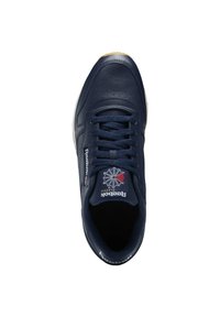 Jūrų nykštukų odiniai sportbačiai su perforuotais detalėmis, balta išore ir Reebok Classic ženkliuku. Yra raištelių dizainas ir paminkštintas apykaklė.