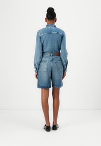 Tommy Hilfiger LANA BERMUDA - Denim shorts - blue denim