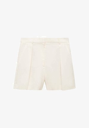 Kermanväriset räätälöidyt shortsit, joissa on laskokset, sileä pinta ja jämäkkä vyötärö. Edessä taskut kummallakin puolella.