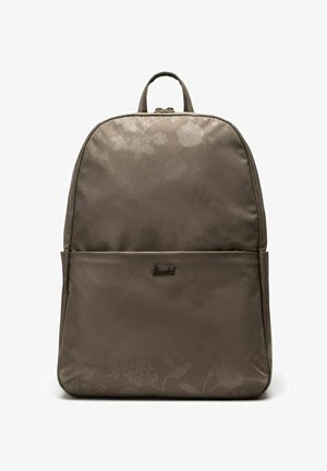 Sac à dos Herschel marron avec un motif floral subtil, poche avant, poignée supérieure et fermeture éclair sur fond blanc.
