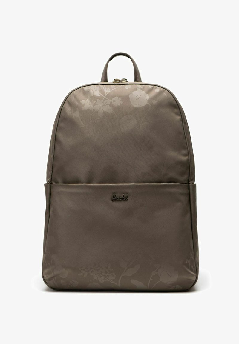 Sac à dos Herschel marron avec un motif floral subtil, poche avant, poignée supérieure et fermeture éclair sur fond blanc.