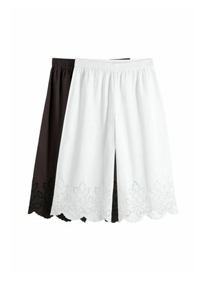Two pairs of knee-length elastic waist shorts, one white and one black, both featuring floral lace cutout details at the hem.