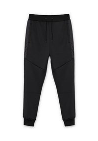 Pantalones jogger negros hechos de tela texturizada con cintura y puños elásticos, que cuentan con bolsillos laterales y detalles de material en contraste.
