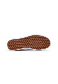 Suela de zapato con una parte inferior de goma marrón que presenta un patrón de panal y un borde blanco. Textura suave con lados reforzados.