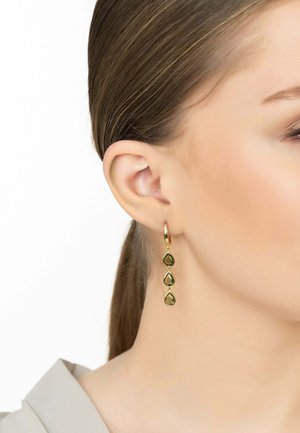 Gold-tone drop earrings featuring three teardrop-shaped green gemstones. Smooth finish, attached by a thin hoop for a hanging design.