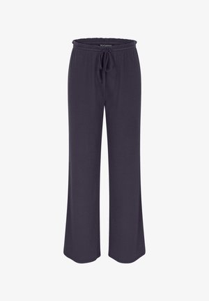 Ciemnofioletowe, szerokie spodnie dresowe z teksturowanej tkaniny, z elastycznym pasem i regulowanym sznurkiem. Bez kieszeni. Lekkie i luźne.