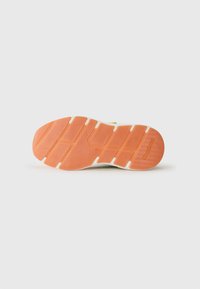Shoe sole in rubber with textured orange pattern and white accents. Features grooves for traction and a rounded heel for stability.
