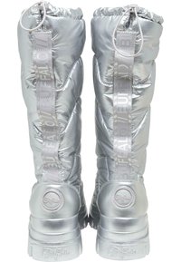Silver puffy ankle boots with elasticized cuffs, thick soles, and branded straps on the sides. Smooth, metallic finish with textured stitching.