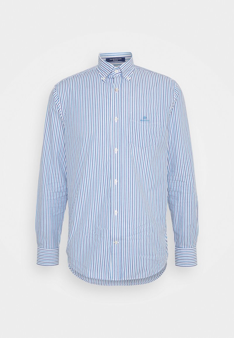 Chemise homme à manches longues boutonnée avec rayures verticales bleues et blanches, col boutonné, poche poitrine et poignets boutonnés.