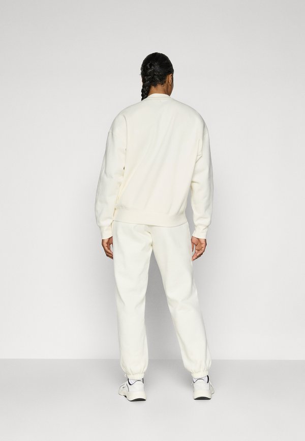 STUDIO SWEATPANTS - Tracksuit bottoms - cannoli cream2
