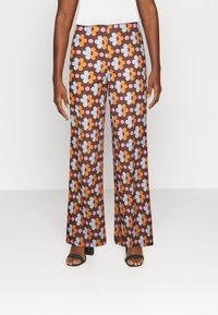 Résumé Spodnie materiałowe