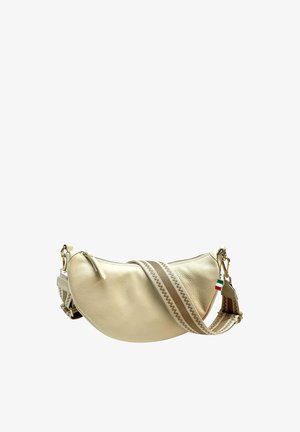 Cream leather crossbody bag with a curved silhouette. Features a striped adjustable strap and small flag detail. Gold-tone hardware accents.