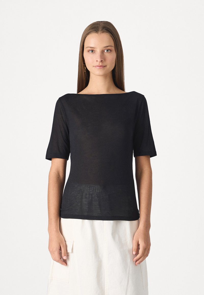 Black, short-sleeve top with a wide neckline. Made from lightweight, textured fabric. Smooth silhouette with a slightly loose fit.
