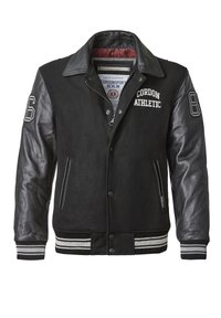 Schwarze Collegejacke mit Lederärmeln, Wolleinsatz, geripptem Kragen und gestreiften Bündchen. Mit dem Text "Cordon Athletic" und Schulternummern.