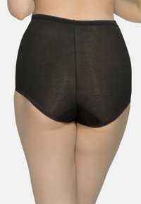 Hoge taille zwarte panty gemaakt van een doorzichtig materiaal, met een gladde tailleband en golfranden voor comfort en pasvorm.