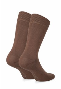 Brązowe skarpetki bawełniane z prążkowanym wykończeniem, gładką teksturą oraz wzmocnionym piętą i palcami. Zawierają nazwę marki wydrukowaną na boku na biało.