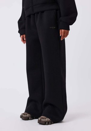 BAS DE JOGGING NÉOPRÈNE - Pantalon de survêtement - noir