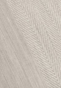 Light gray fabric showing a textured pattern with herringbone design on one side and a smooth finish on the other.